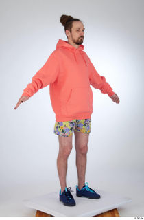 Nigel a-pose blue sneakers dressed floral printed shorts salmon hoodie…